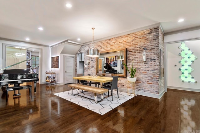 145 Cove Creek Ct, Little Rock, AR 72211 - dining area featuring crown molding, brick wall, baseboards, wood finished floors, and recessed lighting