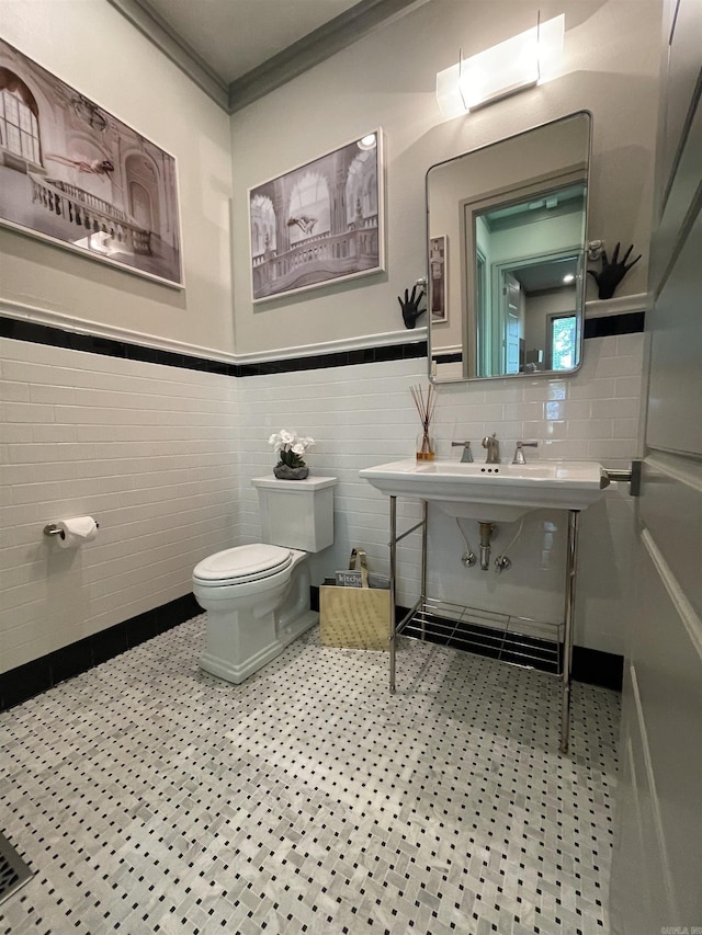 145 Cove Creek Ct, Little Rock, AR 72211 - half bathroom featuring toilet, crown molding, a wainscoted wall, and a sink