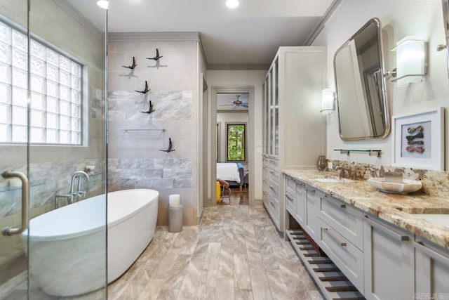 145 Cove Creek Ct, Little Rock, AR 72211 - ensuite bathroom featuring crown molding, a soaking tub, a ceiling fan, double vanity, and recessed lighting