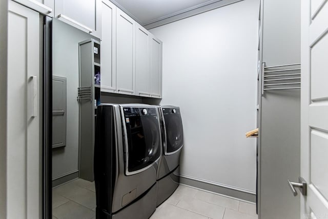 145 Cove Creek Ct, Little Rock, AR 72211 - clothes washing area with washer and clothes dryer, cabinet space, light tile patterned flooring, and baseboards