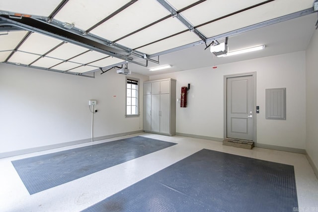 145 Cove Creek Ct, Little Rock, AR 72211 - garage with a garage door opener, electric panel, and baseboards
