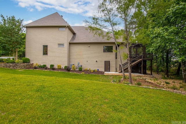 145 Cove Creek Ct, Little Rock, AR 72211 - back of property with stairs, a deck, a lawn, and brick siding