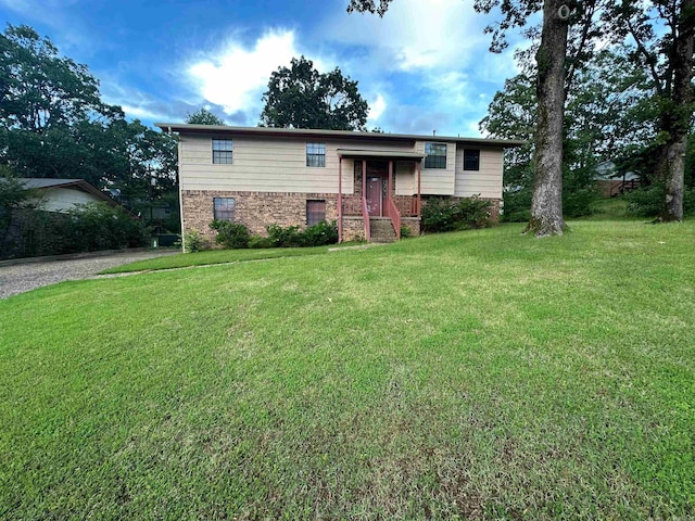 809 Emerald Gardens Dr, North Little Rock, AR 72118 - raised ranch with a front yard and brick siding