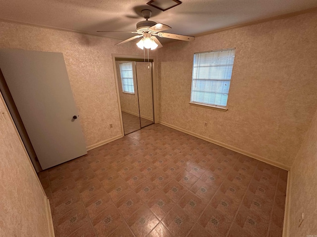 809 Emerald Gardens Dr, North Little Rock, AR 72118 - unfurnished bedroom featuring tile patterned floors, a closet, and ceiling fan