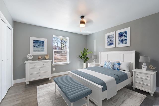 312 Eubanks Rd, Jacksonville, AR 72076 - bedroom featuring wood finished floors, baseboards, a closet, and a ceiling fan