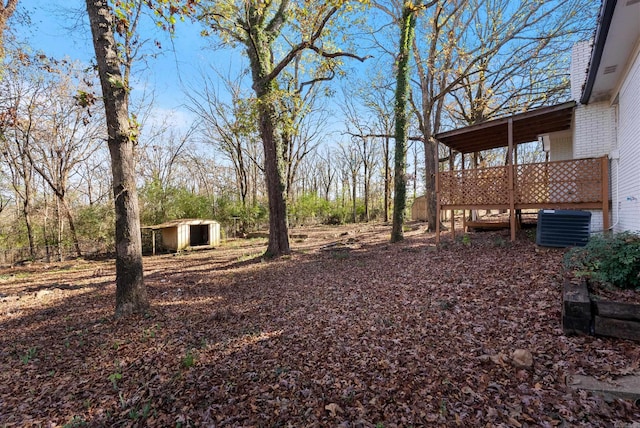 312 Eubanks Rd, Jacksonville, AR 72076 - view of yard featuring an outbuilding, central AC, and a storage shed