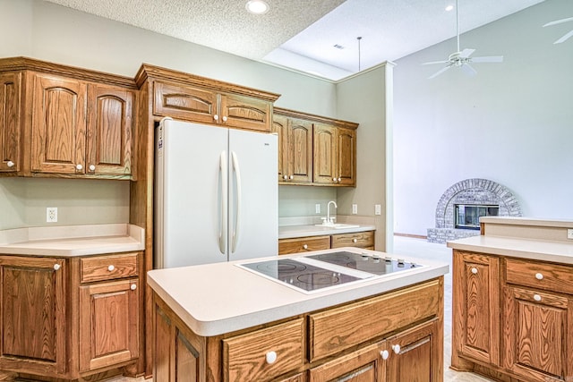 16 Zutano Ln, Hot Springs Village, AR 71909 - kitchen featuring white appliances, a sink, a ceiling fan, light countertops, and a textured ceiling
