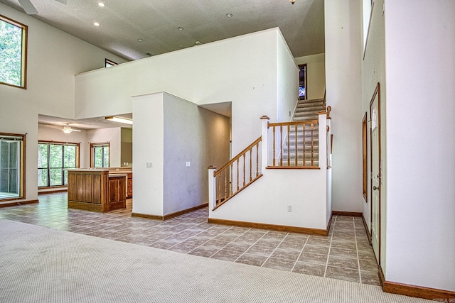 16 Zutano Ln, Hot Springs Village, AR 71909 - interior space featuring high vaulted ceiling, baseboards, tile patterned flooring, a ceiling fan, and recessed lighting