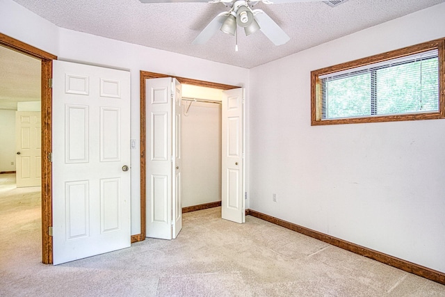 16 Zutano Ln, Hot Springs Village, AR 71909 - unfurnished bedroom with light colored carpet, a textured ceiling, baseboards, a closet, and ceiling fan