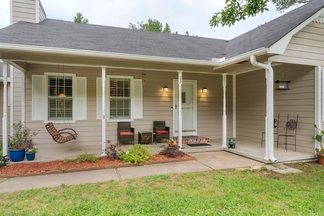 23 S Summit Dr, Cabot, AR 72023 - view of exterior entry with covered porch, a chimney, and roof with shingles