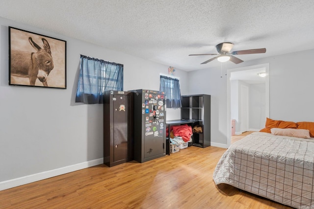 23 S Summit Dr, Cabot, AR 72023 - bedroom featuring wood finished floors, a textured ceiling, baseboards, and ceiling fan