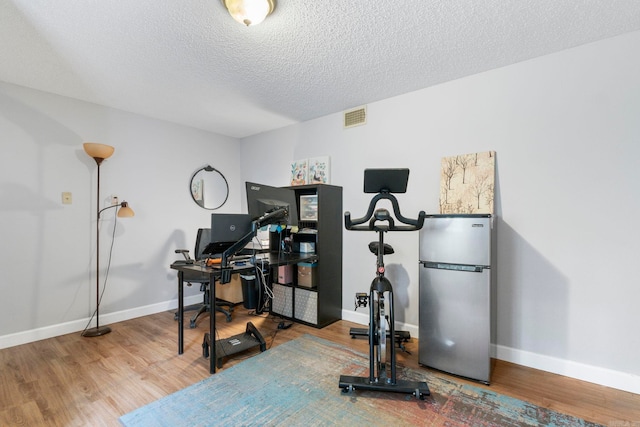 23 S Summit Dr, Cabot, AR 72023 - home office with wood finished floors, baseboards, and a textured ceiling
