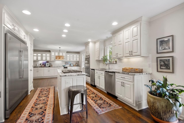2820 N Rodney Parham Rd, Little Rock, AR 72212 - kitchen with stainless steel appliances, white cabinets, a center island, glass insert cabinets, and recessed lighting