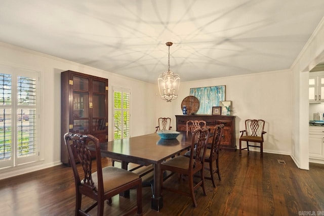2820 N Rodney Parham Rd, Little Rock, AR 72212 - dining room featuring a chandelier, dark wood-style flooring, and ornamental molding