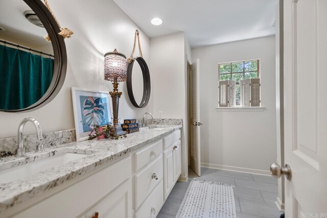 2820 N Rodney Parham Rd, Little Rock, AR 72212 - bathroom with double vanity and baseboards