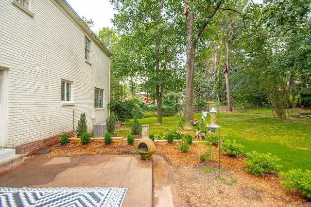 2820 N Rodney Parham Rd, Little Rock, AR 72212 - view of green lawn with a patio and view of wooded area