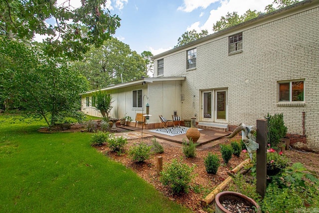 2820 N Rodney Parham Rd, Little Rock, AR 72212 - back of house featuring a patio area, a yard, and brick siding