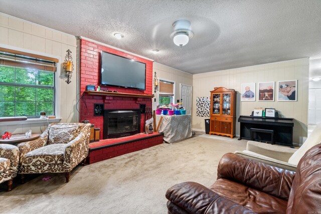 7104 Foxrun E End Dr, Mabelvale, AR 72103 - living area featuring a fireplace, a textured ceiling, carpet floors, and a ceiling fan