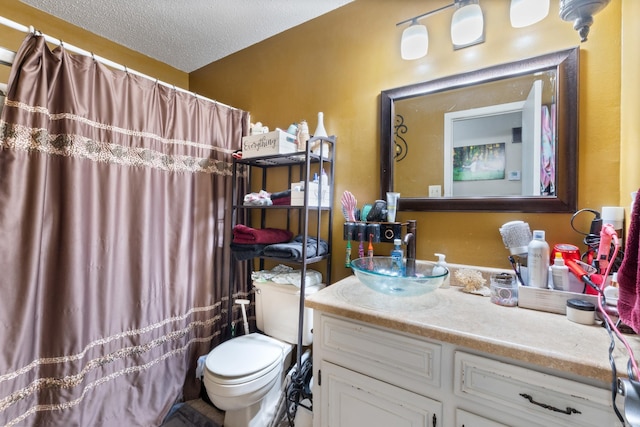 7104 Foxrun E End Dr, Mabelvale, AR 72103 - full bathroom with toilet, vanity, a textured ceiling, and curtained shower