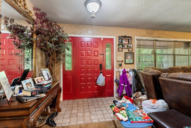 7104 Foxrun E End Dr, Mabelvale, AR 72103 - foyer entrance with a textured ceiling and light tile patterned flooring