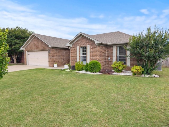 ranch-style home with brick siding, driveway, an attached garage, a front lawn, and roof with shingles