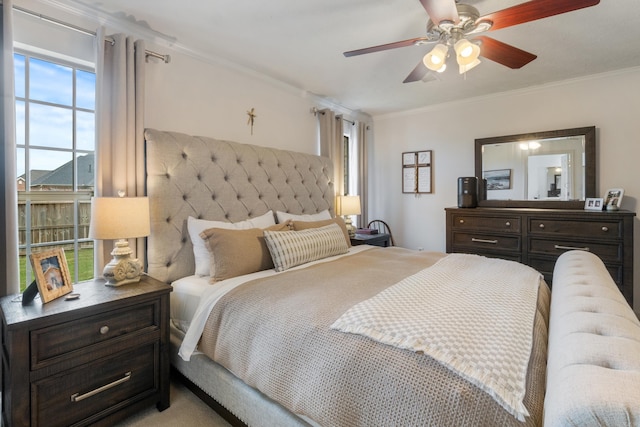 bedroom featuring ornamental molding and ceiling fan
