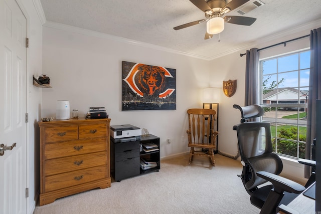 office space with light carpet, ceiling fan, crown molding, a textured ceiling, and baseboards