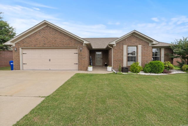 ranch-style home with concrete driveway, brick siding, an attached garage, and a front yard