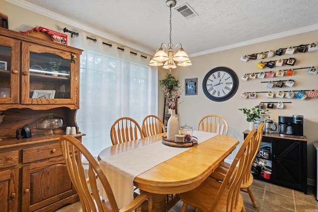 dining area featuring ornamental molding, a chandelier, and a textured ceiling
