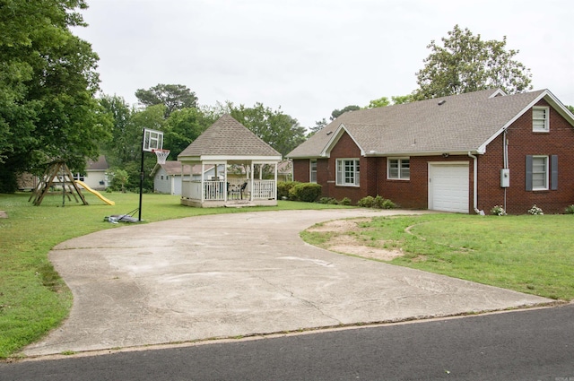 1400 Tulip Ave, Searcy, AR 72143 - view of front of property featuring curved driveway, a gazebo, brick siding, a front yard, and an attached garage