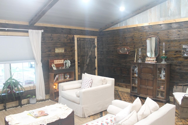 living room with wooden walls, vaulted ceiling, and wood finished floors
