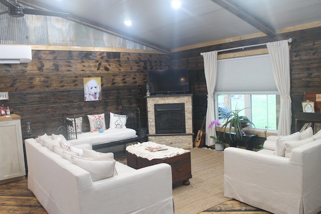 living area featuring lofted ceiling, a wall unit AC, wood finished floors, a fireplace, and wooden walls