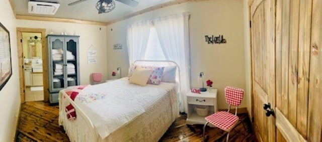 bedroom featuring dark wood-style flooring