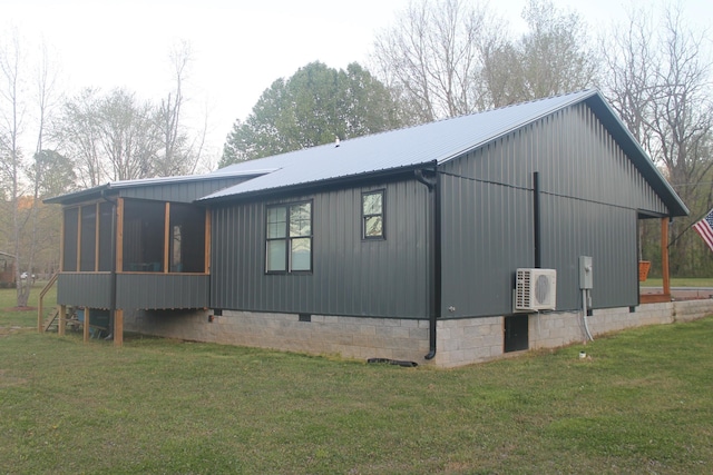 view of side of property with ac unit, a sunroom, a lawn, and crawl space