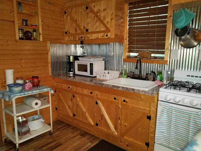 3227 Red Bluff Rd, Marshall, AR 72650 - kitchen featuring white appliances, a sink, wood finished floors, and wooden walls