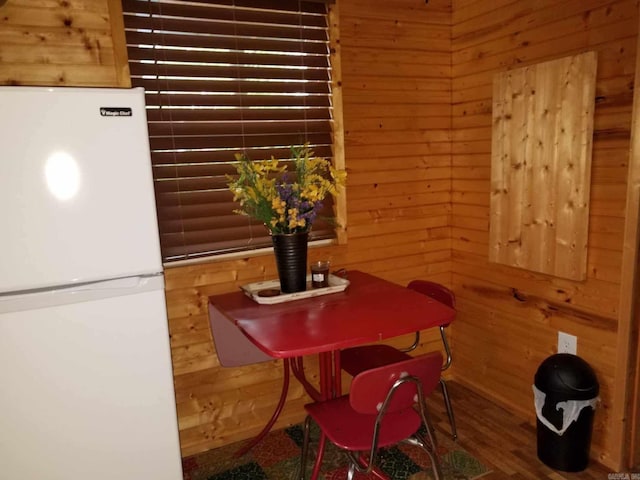 3227 Red Bluff Rd, Marshall, AR 72650 - dining room featuring wood walls and wood finished floors