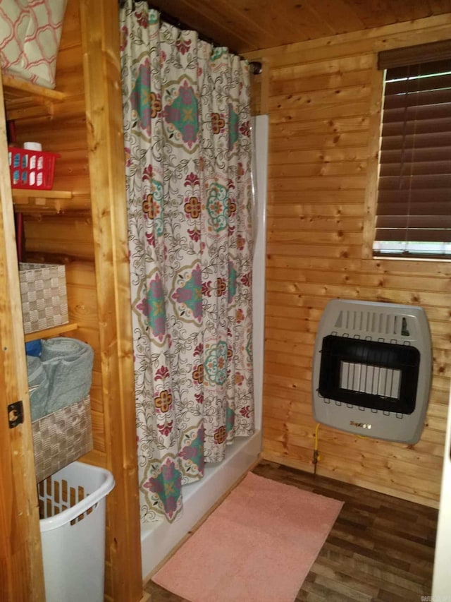 3227 Red Bluff Rd, Marshall, AR 72650 - full bathroom with heating unit, curtained shower, wood finished floors, wood ceiling, and wooden walls