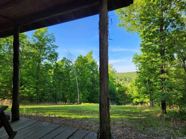 3227 Red Bluff Rd, Marshall, AR 72650 - deck with a forest view and a lawn