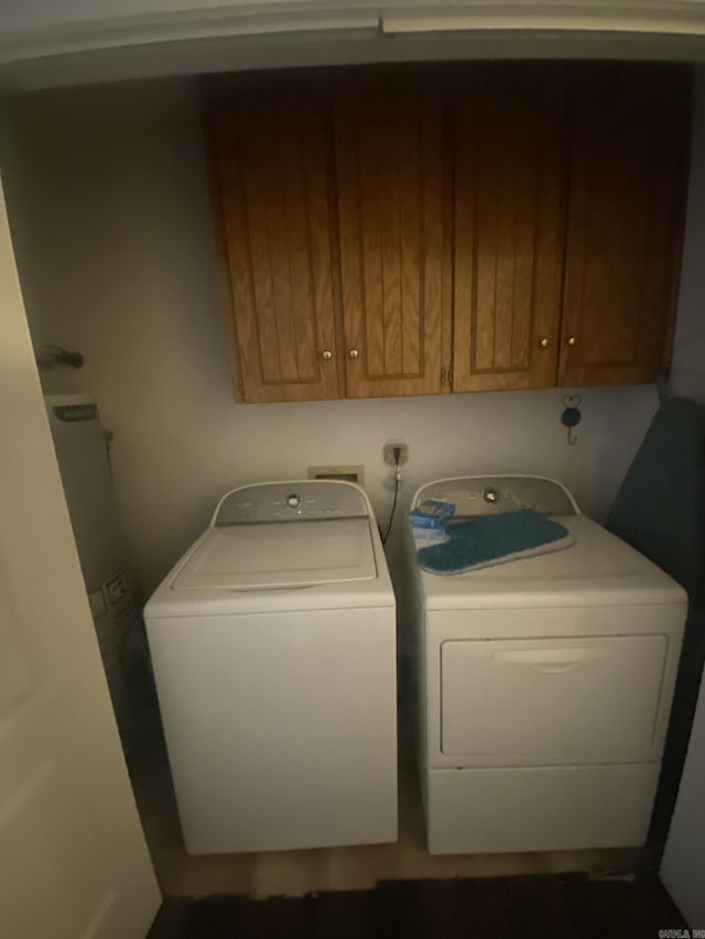 111 Dales Dr, Jacksonville, AR 72076 - washroom with washer and clothes dryer, cabinet space, and water heater