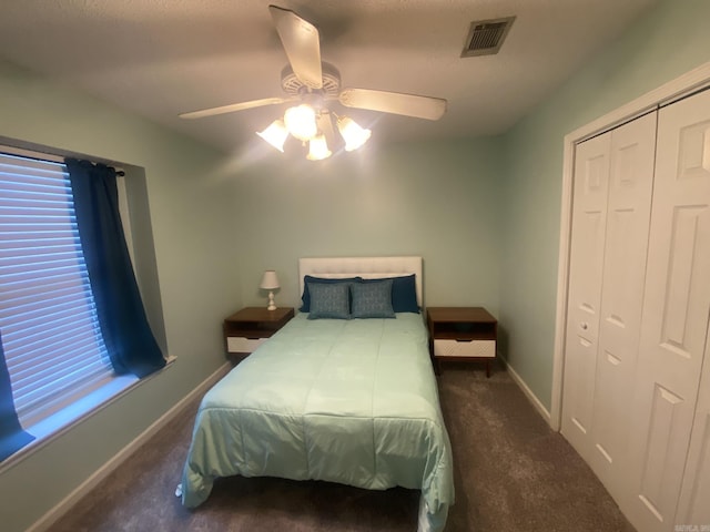 111 Dales Dr, Jacksonville, AR 72076 - bedroom featuring carpet floors, baseboards, ceiling fan, and a closet