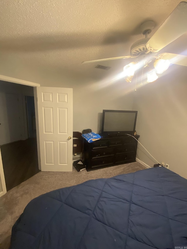 111 Dales Dr, Jacksonville, AR 72076 - bedroom with carpet, a textured ceiling, and a ceiling fan