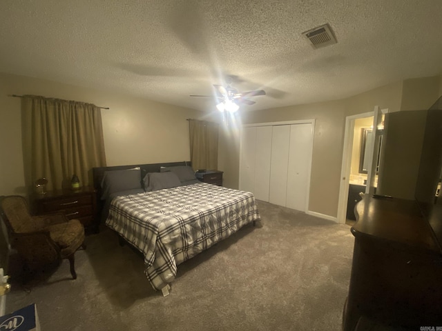 111 Dales Dr, Jacksonville, AR 72076 - carpeted bedroom featuring a closet, a textured ceiling, and ceiling fan