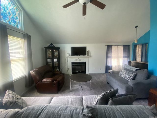 111 Dales Dr, Jacksonville, AR 72076 - living room featuring vaulted ceiling, carpet flooring, ceiling fan, and a glass covered fireplace