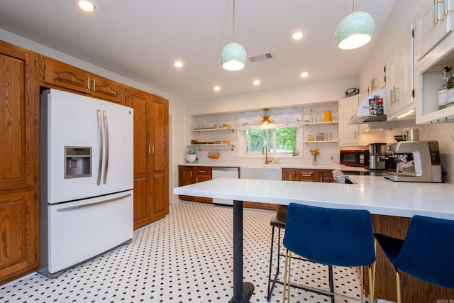 375 Goshen Ave, North Little Rock, AR 72116 - kitchen with white appliances, open shelves, a peninsula, light countertops, and recessed lighting