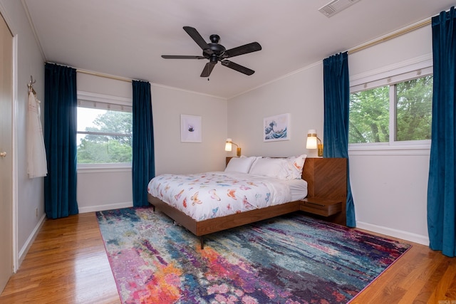 375 Goshen Ave, North Little Rock, AR 72116 - bedroom with wood finished floors, baseboards, ornamental molding, and ceiling fan