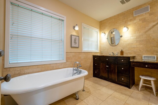 375 Goshen Ave, North Little Rock, AR 72116 - full bath with tile walls, tile patterned floors, vanity, and a soaking tub