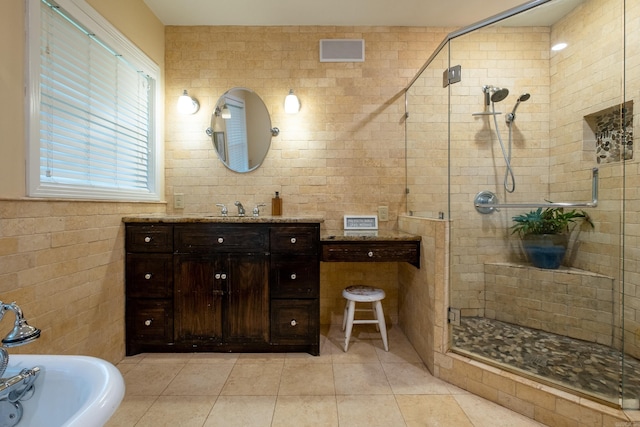 375 Goshen Ave, North Little Rock, AR 72116 - bathroom featuring tile walls, a shower stall, tile patterned floors, and vanity