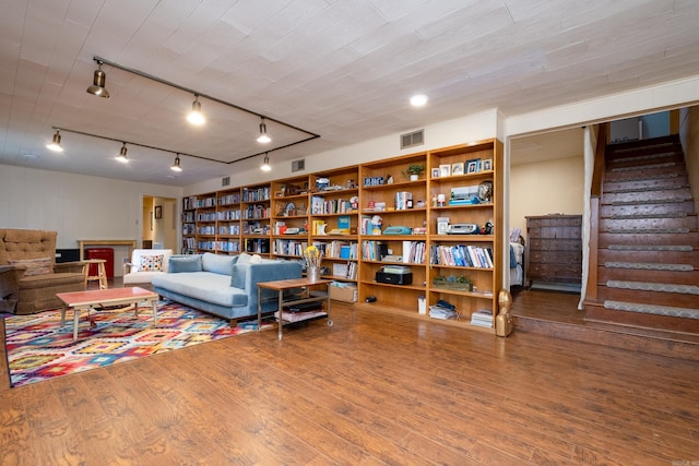 375 Goshen Ave, North Little Rock, AR 72116 - living area featuring stairs, wood finished floors, and track lighting