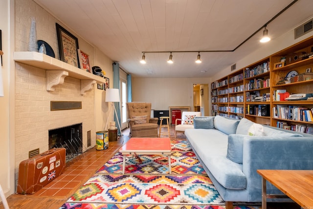 375 Goshen Ave, North Little Rock, AR 72116 - living room with rail lighting and a fireplace