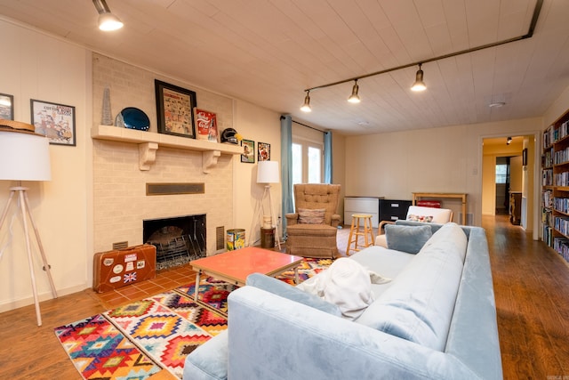 375 Goshen Ave, North Little Rock, AR 72116 - living area featuring track lighting, a fireplace, wood finished floors, and wooden ceiling